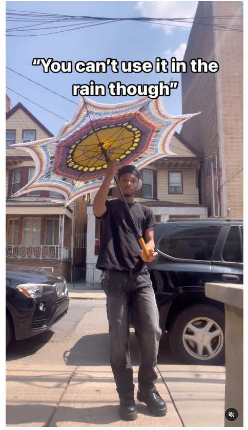 video of person holding an umbrella with caption you cant use it in the rain though 